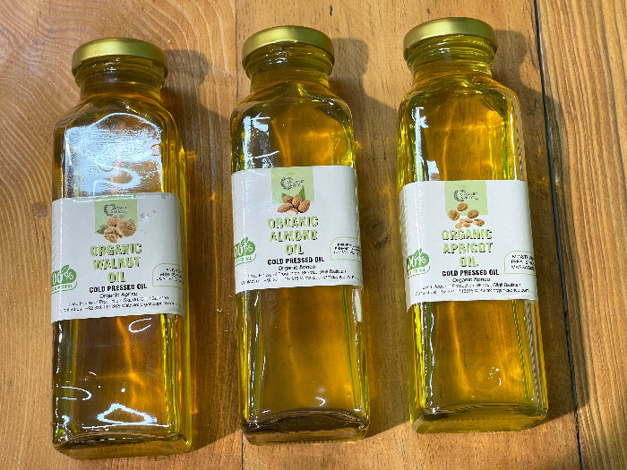 Three Bottles of Walnut Oil by Organic Aprico